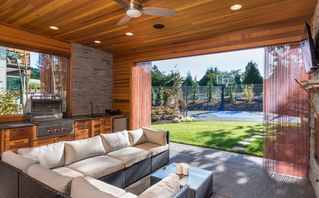 luxurious covered patio with barbecue and sink