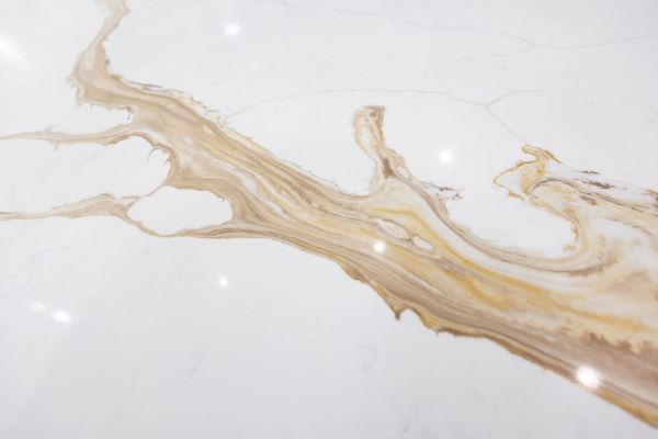 Close up of a countertop showing off a gold vein. 
